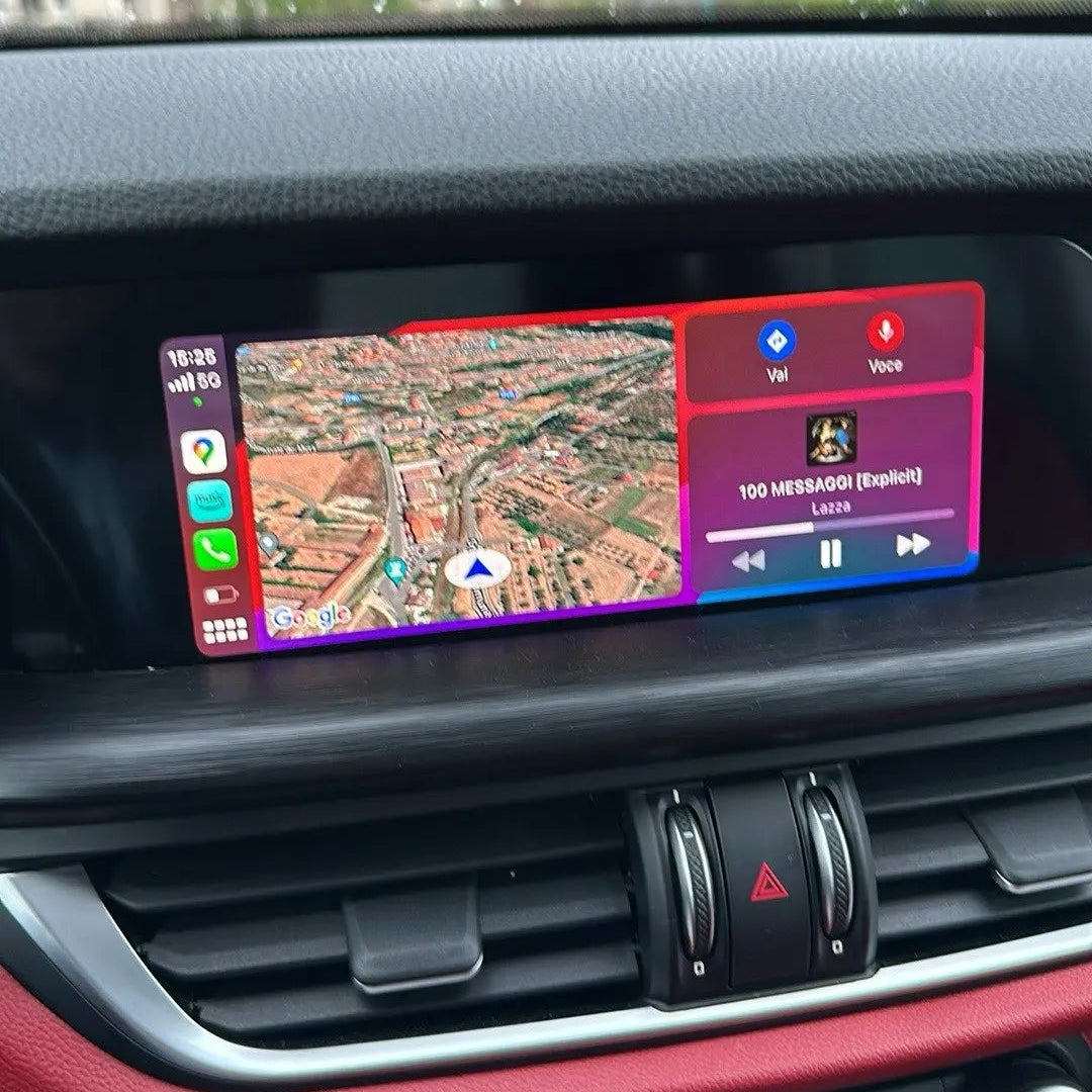 Alfa Romeo interior dashboard showing the integrated wireless Apple CarPlay navigation on the infotainment screen during the day.