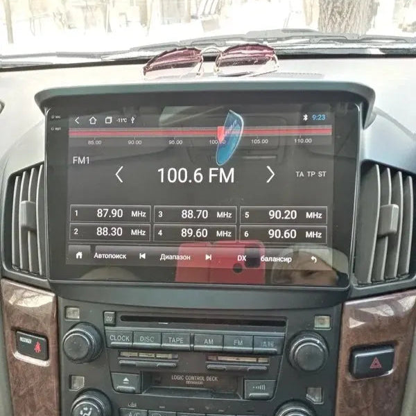 Car stereo system with digital display showing radio frequencies