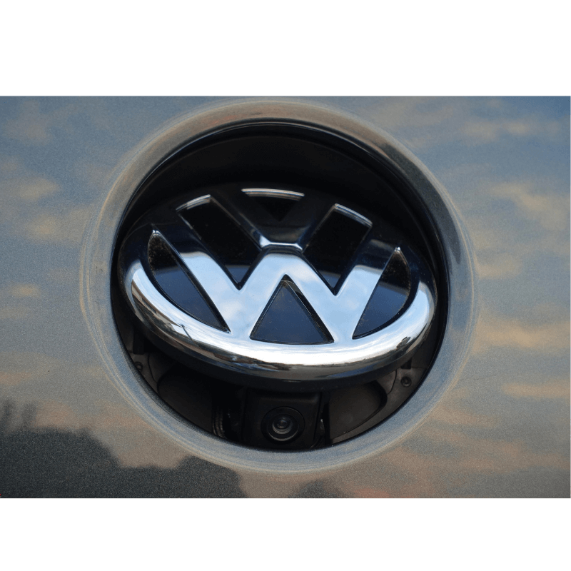 Close-up of a Volkswagen car boot logo reverse camera system.